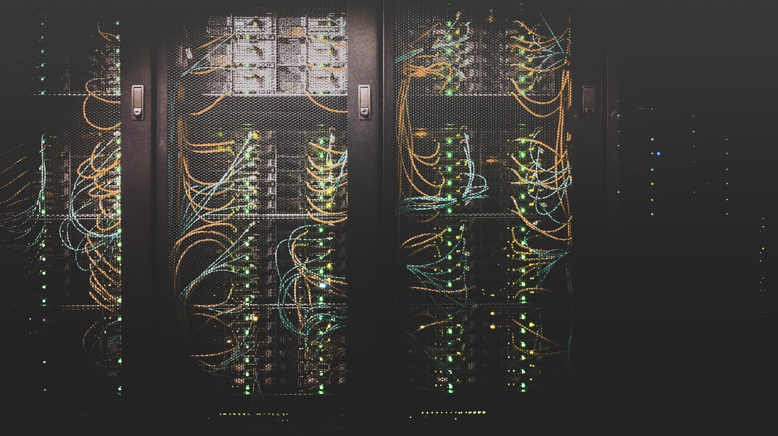 Rows of datacenter server racks with status lights and cabling