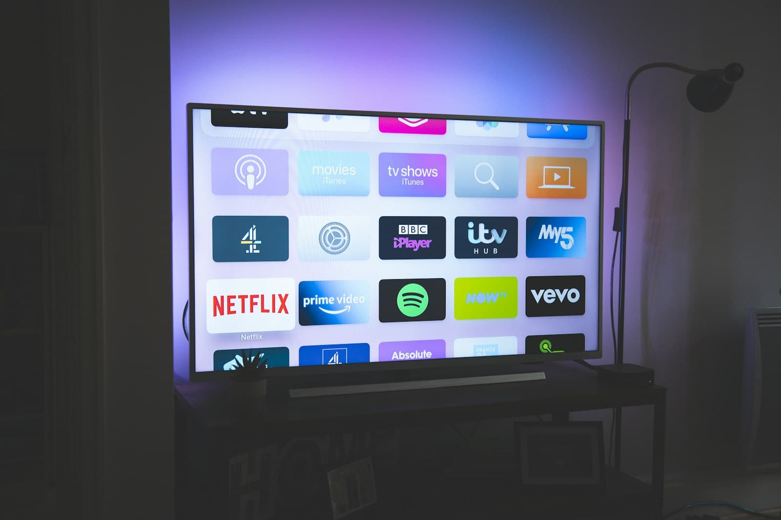 Smart TV showing rows of streaming app tiles